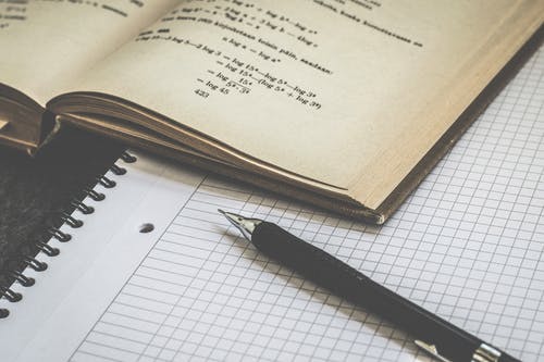 A notebook and a pencil